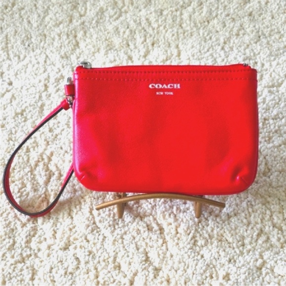 COACH DEEP ORANGE WRISTLET Like New
